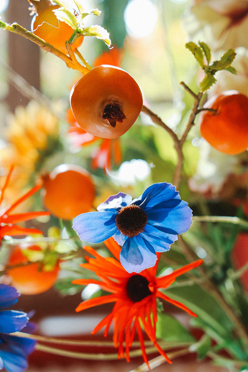 Silk flowers and fruits close-up